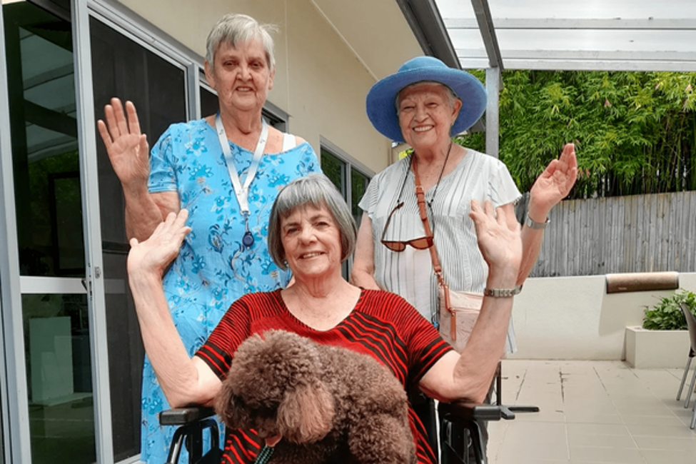 Staff and residents at Churches of Christ's Dianella Apartments at Mitchelton with the donated wheelchair